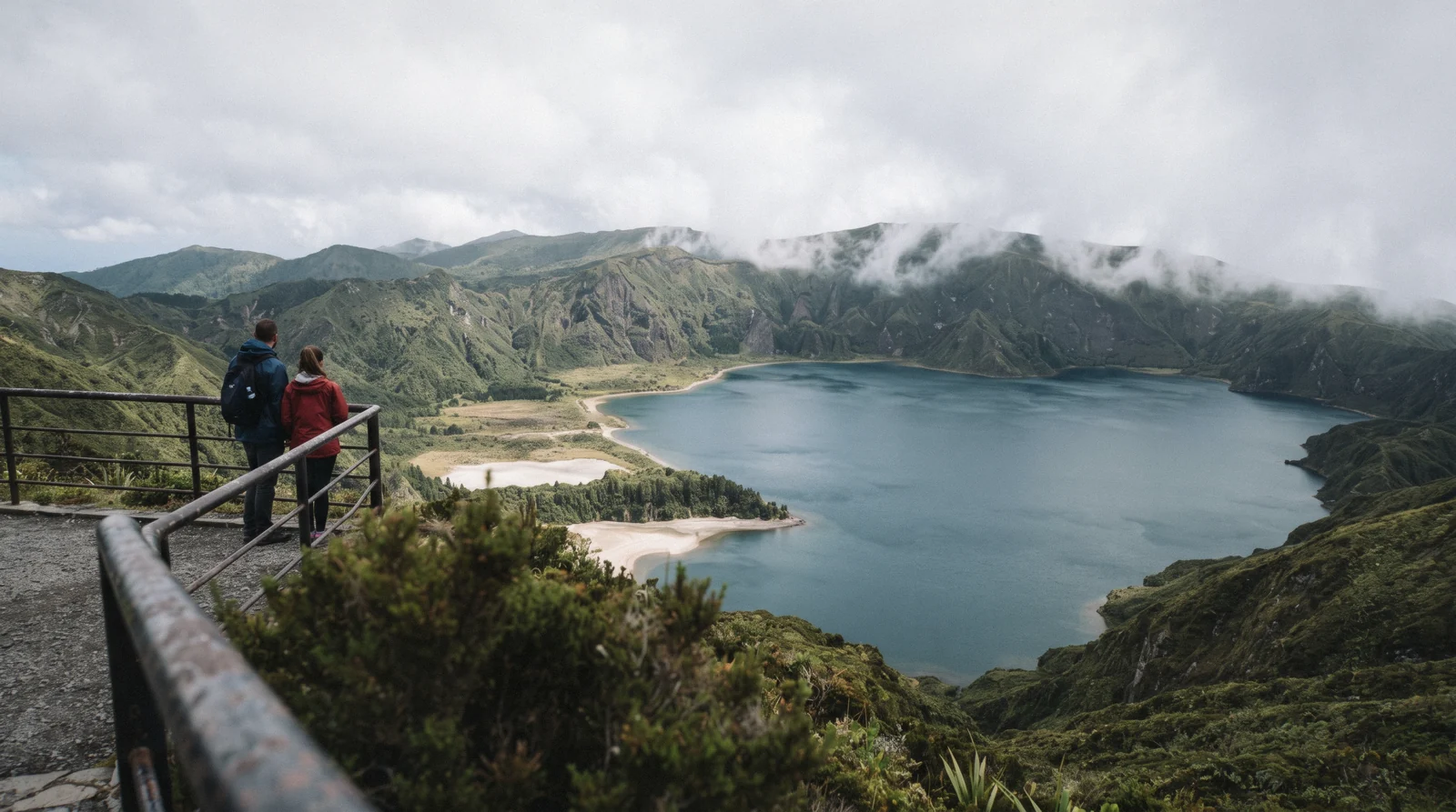 The white crater of Lagoa do Fogo and its blue lake seen from the Miradouro da Lagoa do Fogo on São Miguel