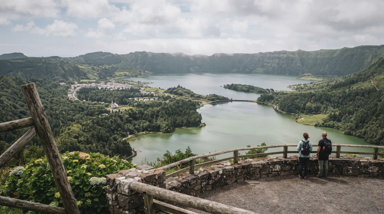 The green and blue twin lakes of Sete Cidades inside their volcanic crater on São Miguel, seen from the Miradouro da Vista do Rei