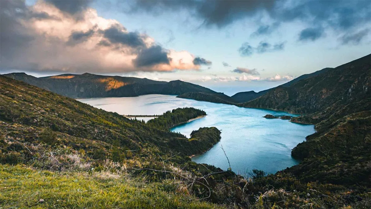 The twin lakes of Sete Cidades under heavy cloud from the crater rim, as seen on this private Azores island tour