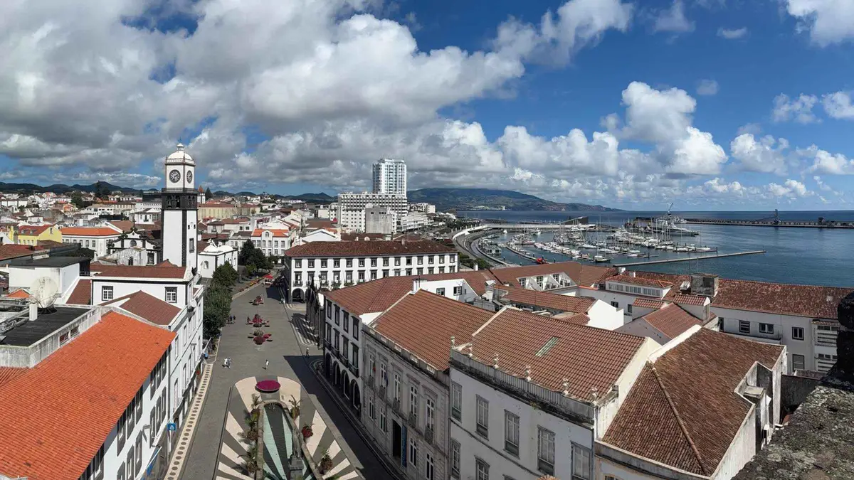The city gates, rooftops and marina of Ponta Delgada seen from above on the historical walking tour