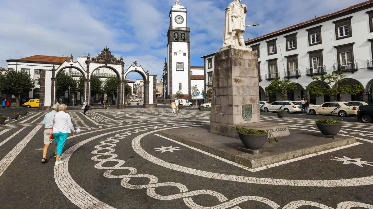 The Portas da Cidade gates and patterned pavement of central Ponta Delgada on a half-day city tour