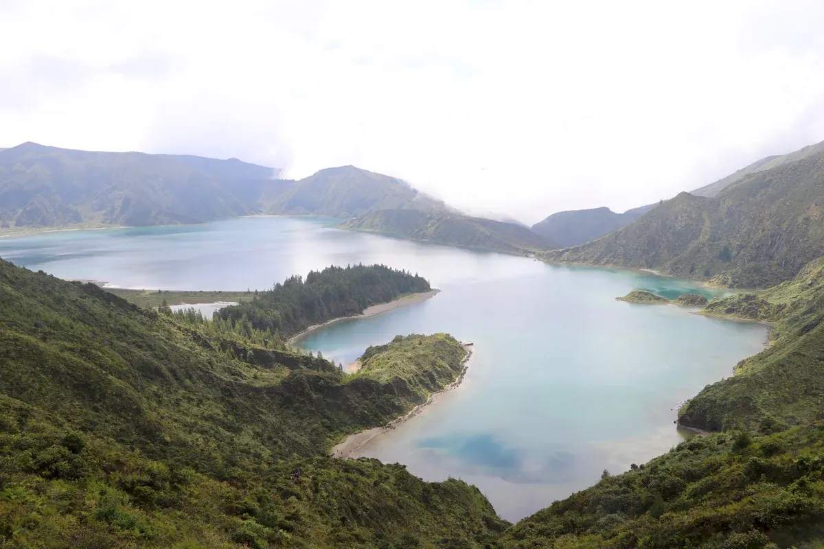The caldeira lake seen from the crater rim under low cloud